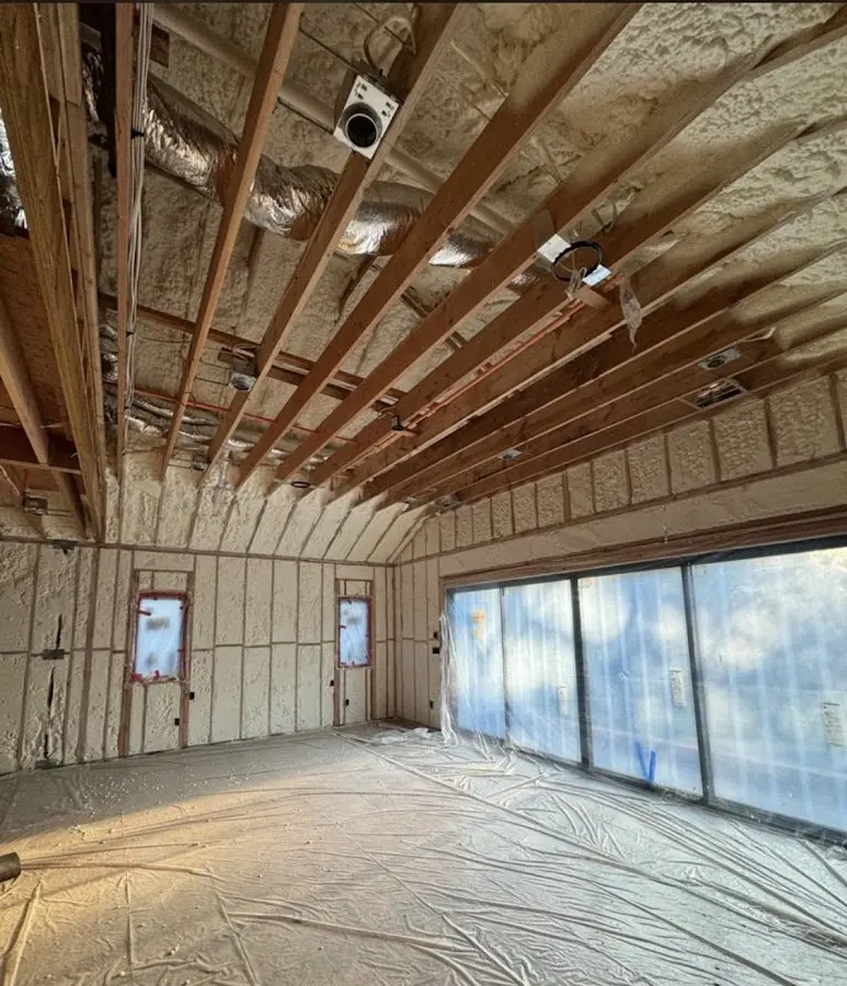 Interior walls and ceiling insulated with spray foam during new construction in York